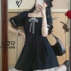 Black waist puffy dress with ruffled details and a bow, dark kawaii aesthetic.