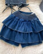 Blue denim coquette denim set featuring a ruffled skirt and crop top.