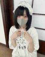 Model wearing a kawaii loose t-shirt with handwritten text and a headband.