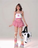 Pink ruffle kawaii lolita mini skirt with matching top and leg warmers, Harajuku style.