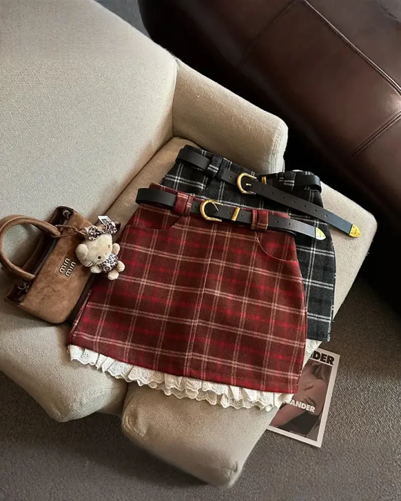 Plaid mini skirt in preppy aesthetic, featuring a plaid pattern and trim.