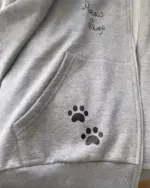 Close-up of a cat paw print hoodie, showcasing the kawaii design. Cat paw hoodie.