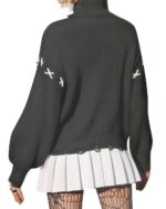 Back view of a gothic aesthetic sweater with crossed stitching details and a relaxed fit.