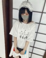 Person wearing a kawaii loose t-shirt with Japanese text.