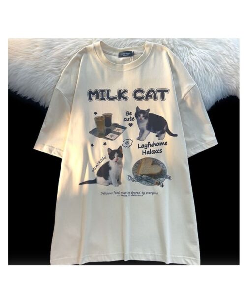 Cream colored milk cat t-shirt featuring illustrations of cats and text design.