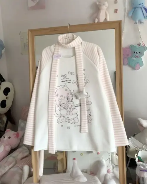 White striped nyanko pink t-shirt with cute character print, cutecore aesthetic.