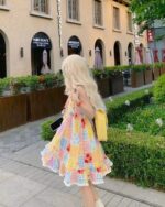 A woman wearing a cute colorful jojifuku aesthetic dress outdoors.