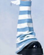 Close-up of blue and white striped gyaru socks, showcasing Harajuku aesthetic.
