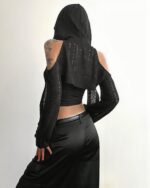 Black hooded cut out top with gothic aesthetic details, featuring a dramatic back design.