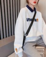 White korean aesthetic sweatshirt featuring a cute bear design and lettering.