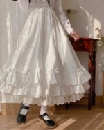 White gothic lolita ruffled skirt with layers of ruffles and lace trim. High waist design.