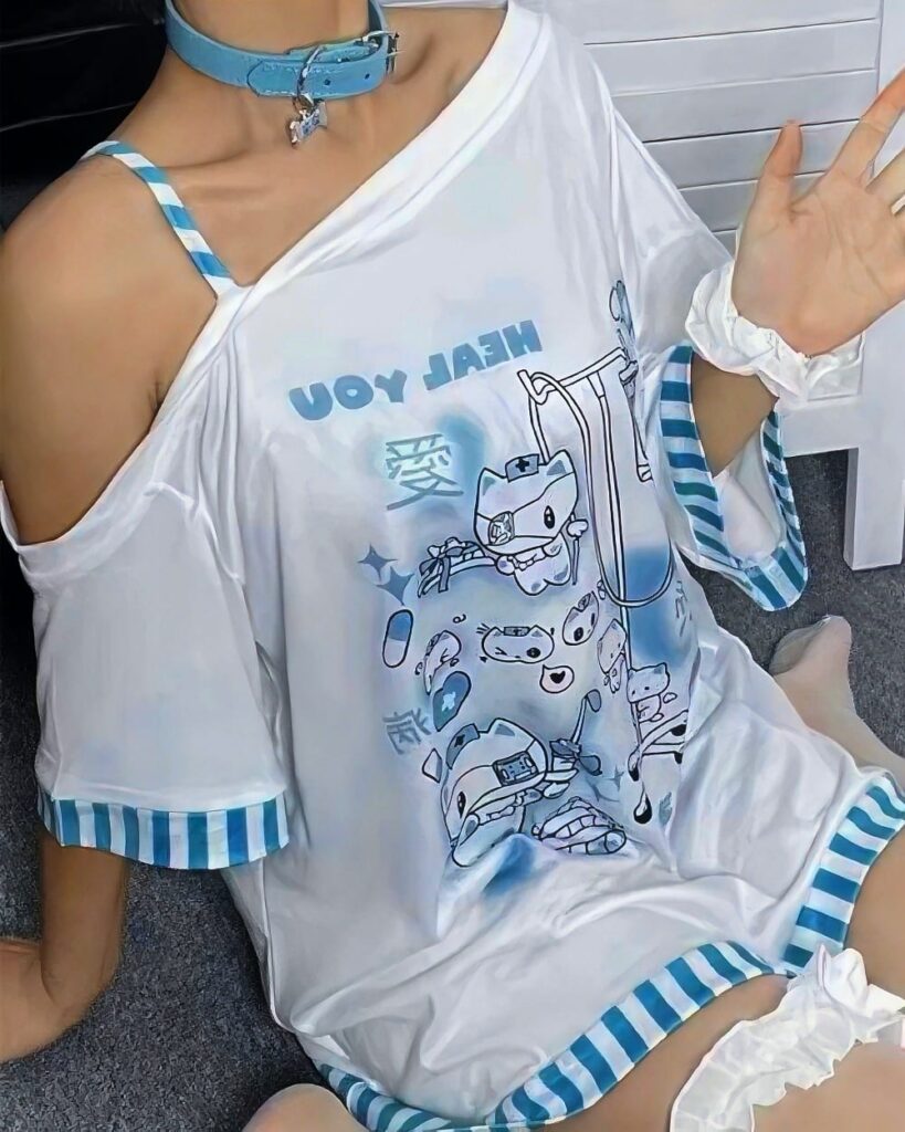 Blue nurse cat shirt with playful cartoon illustration on white fabric, cut-out sleeves.