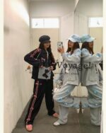 Two people wearing a korean aesthetic set; a black hoodie & gray pants with blue trim.