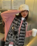 Cartoon animal winter scarf featuring a cat design, cute core aesthetic.
