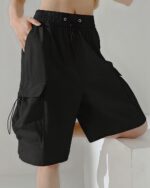 Black casual loose shorts with pockets, a Korean aesthetic design.