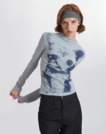 Gray el gato sweatshirt with a blue graphic print on a long-sleeve turtleneck.