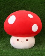 Red giant mushroom plushie with white polka dots, a cute face, and soft fabric.