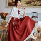 Retro style cottagecore aesthetic dress with a gathered skirt and lace trim.