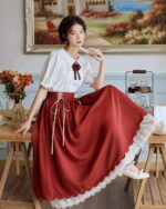 Retro style cottagecore aesthetic dress with a gathered skirt and lace trim.