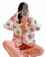 Kawaii strawberry pajamas set featuring a sherpa fleece jacket and pants. Cute strawberry pattern.
