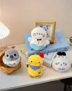 Collection of fan-made love and deepspace plushies, featuring various characters on a book.