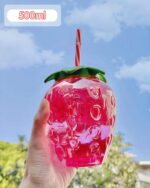 Pink strawberry water bottle with straw, 500ml capacity, kawaii design.