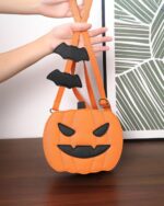 Cute pumpkin halloween bag with bat accents, crossbody style.
