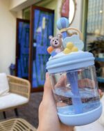 Close-up of a kawaii bear bottle - U Cup, featuring a blue bear and bubble straw.