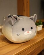 Kawaii chonky cat plushie – Loaf Bread Edition, a soft grey stuffed animal with black accents.