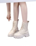 Cream colored gothic over knee boots with laces and thick sole.
