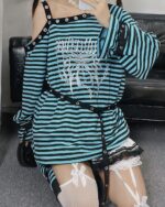 Blue and black striped punk lolita set with lace trim and multiple straps.