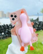 Pink duck iphone case showing a kawaii design with cloud details.