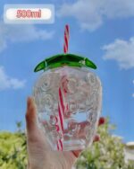 Clear kawaii strawberry water bottle with a straw and lid, 500ml capacity.