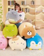 Kawaii animal mochi plushies collection: cat, dog, penguin and more, displayed on a shelf.