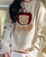 Cottagecore bear sweater featuring an apple and bear design on a soft knit.