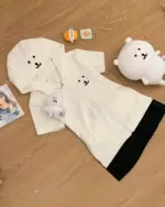 White jojifuku aesthetic hoodie with character embellishments and plush toys.