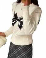 White Korean aesthetic sweater with a large black bow print on the chest.