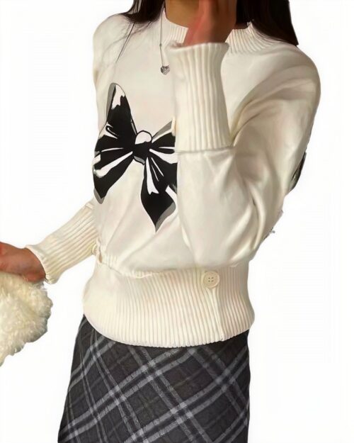 White Korean aesthetic sweater with a large black bow print on the chest.