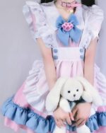 A pink and blue kawaii maid dress with ruffles, featuring a bow and choker, alongside a white plush bunny.