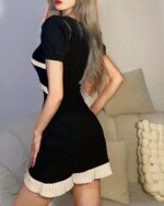Black Korean aesthetic dress with lace detailing and a pleated skirt.