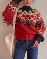 Detailed kawaii winter sweater with a festive geometric pattern and fringe details.
