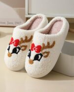 White christmas plushy slippers featuring reindeer details.