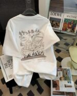 White retro japanese print t-shirt displayed on magazines.