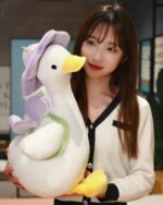 Kawaii Molly the Little Flower duck plushie toy, a large white and purple plush duck held by a woman.