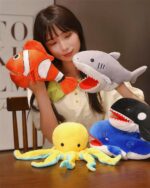 Kawaii animal puppets including a clownfish, shark, octopus, and whale plush toys.