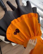 Orange and black cute halloween dress with kawaii embroidered ghost details.