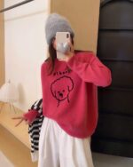 Red puppy doodle sweater featuring a cute doodle dog graphic.