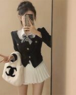 College Girl Student Set - Korean Aesthetic featuring a black and white blouse with bow and pleated skirt.