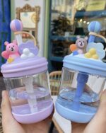 Close-up of a kawaii bear bottle - U Cup, featuring a clear glass bottle with a straw and decorative bear accents.