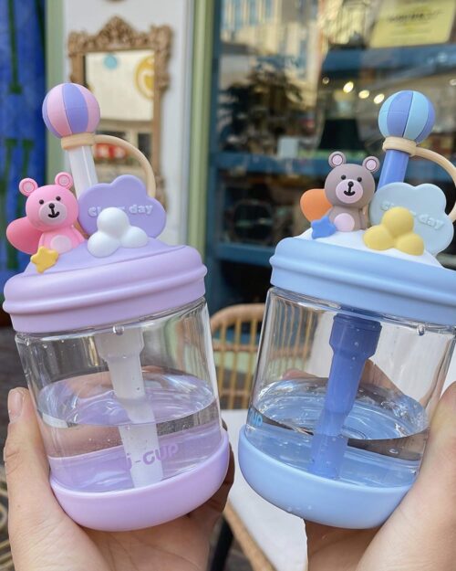 Close-up of a kawaii bear bottle - U Cup, featuring a clear glass bottle with a straw and decorative bear accents.